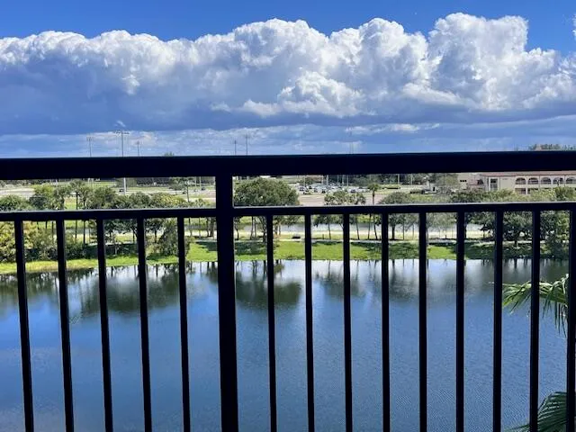 a view of a fountain in front of a brick building