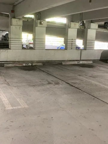 a living room with lots of furniture and a large window