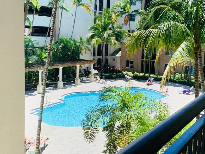 1660 Renaissance Commons Boulevard, Unit 2608 Boynton Beach, FL 33426 - Photo 3 of 31 a swimming pool with outdoor seating and yard