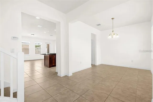 a view of a kitchen with a sink and a living room