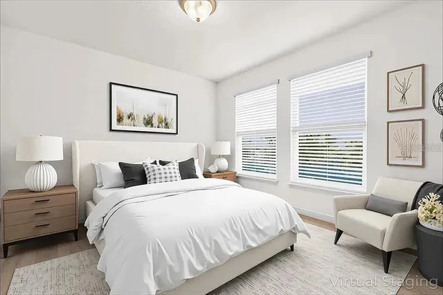 a bedroom with a bed and a couch