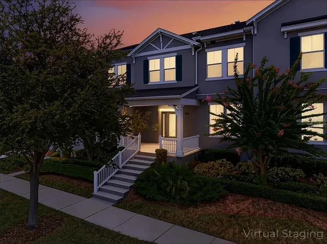 a front view of a house with garden