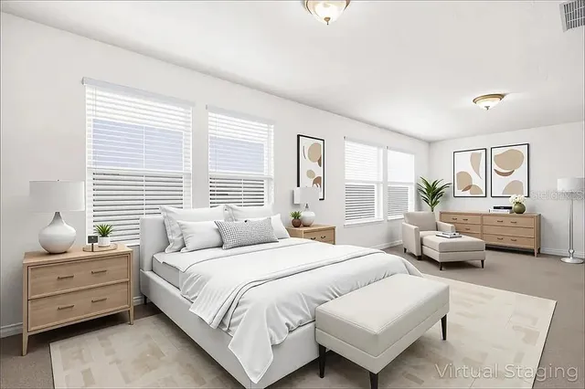 a bedroom with bed and large windows