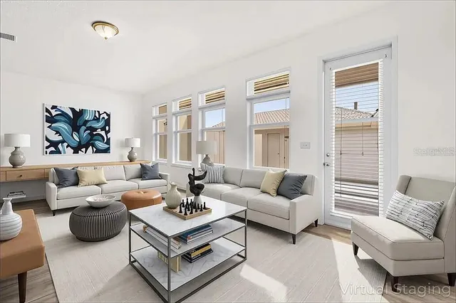 a living room with furniture and a large window