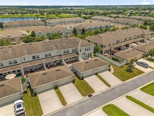 an aerial view of a house with a lake view