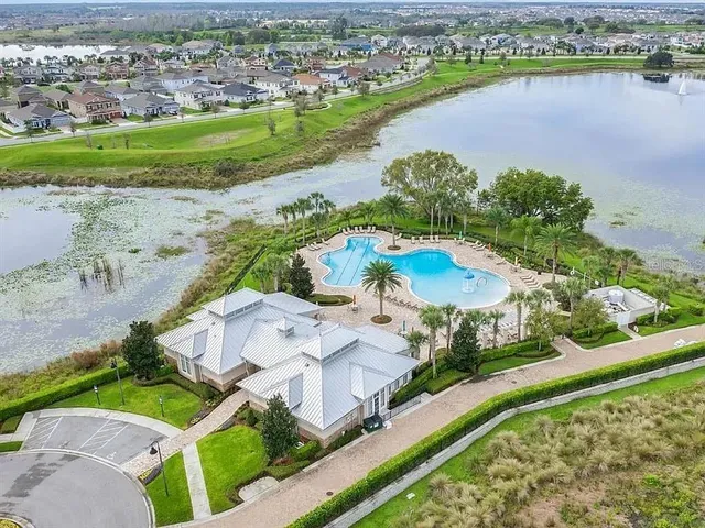 an aerial view of a house with a lake view