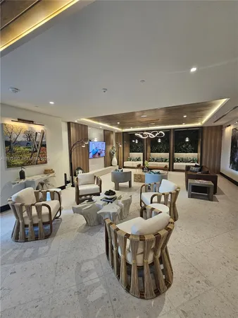 a living room with lots of furniture and view of couch