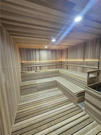 a view of an empty room with wooden walls