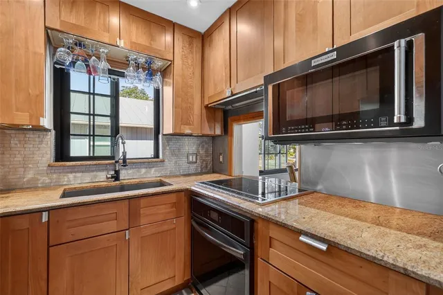 a kitchen with a sink and cabinets