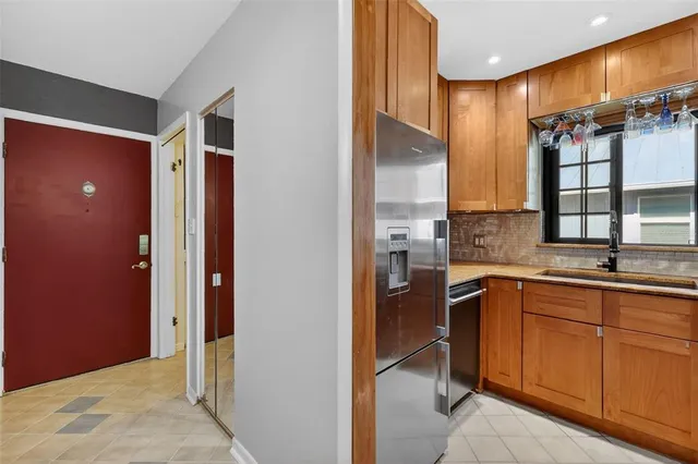 a view of a bathroom with a sink and mirror