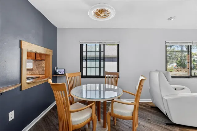 a view of a dining room with furniture window and wooden floor