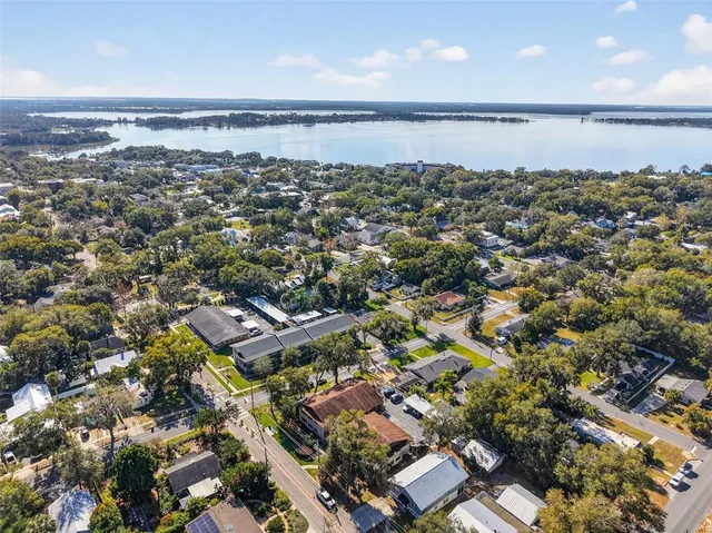 an aerial view of a city with ocean view