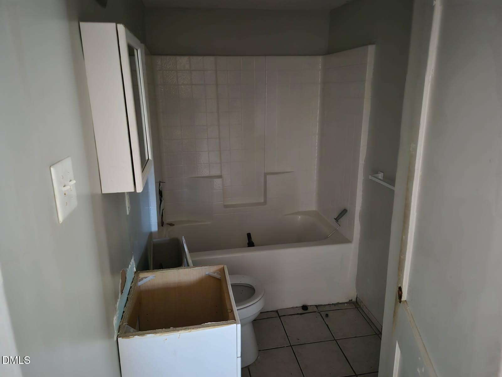 621 Clyde Street Rocky Mount, NC 27803 - Photo 3 of 4 a bathroom with a sink and bathtub with shower