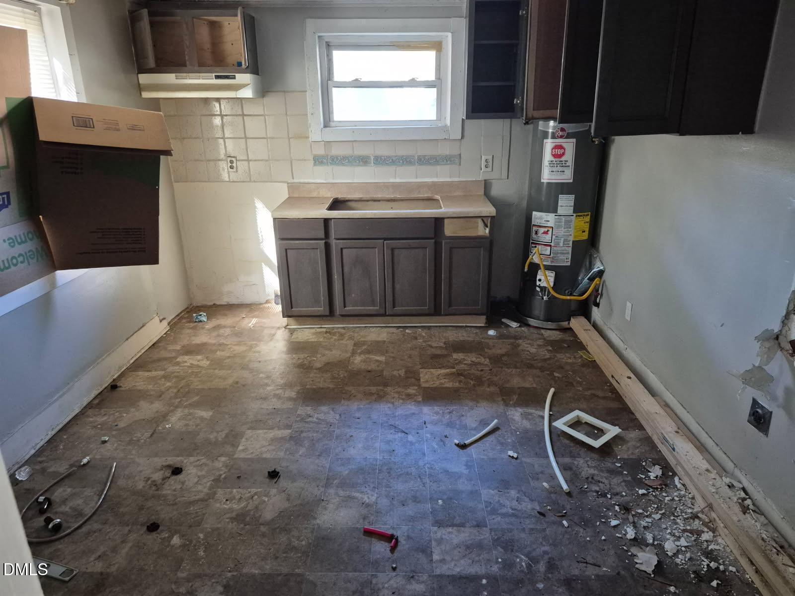 621 Clyde Street Rocky Mount, NC 27803 - Photo 4 of 4 a room with a washing machine