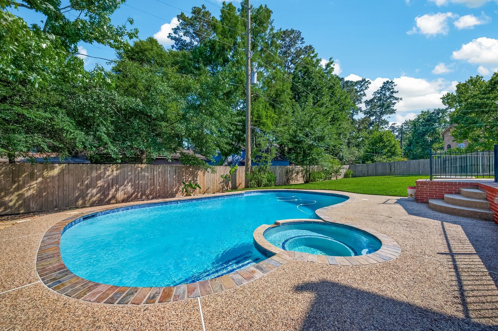 6131 Hampton Way Court Spring, TX 77389 - Photo 41 of 50 a view of a swimming pool with a yard and sitting area
