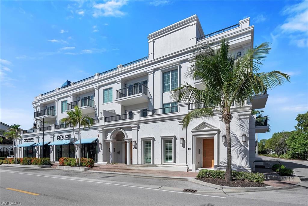 490 5th Street South, Unit 101 Naples, FL 34102 - Photo 2 of 50 a view of a building with a street