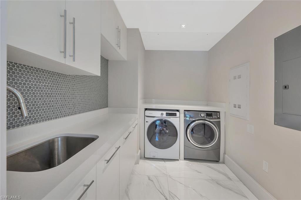 490 5th Street South, Unit 101 Naples, FL 34102 - Photo 40 of 50 a utility room with dryer and washer