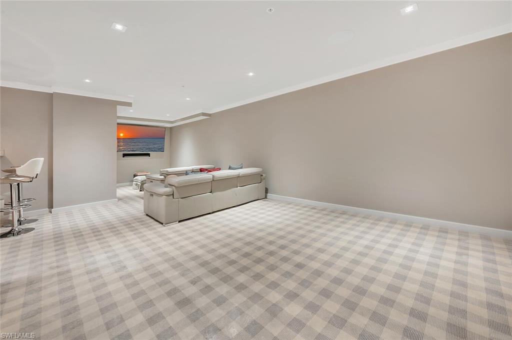 490 5th Street South, Unit 101 Naples, FL 34102 - Photo 42 of 50 a room with bed and window