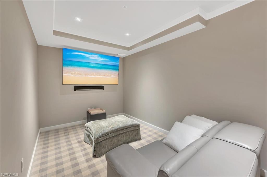 490 5th Street South, Unit 101 Naples, FL 34102 - Photo 43 of 50 a bedroom with a bed and a wall painting