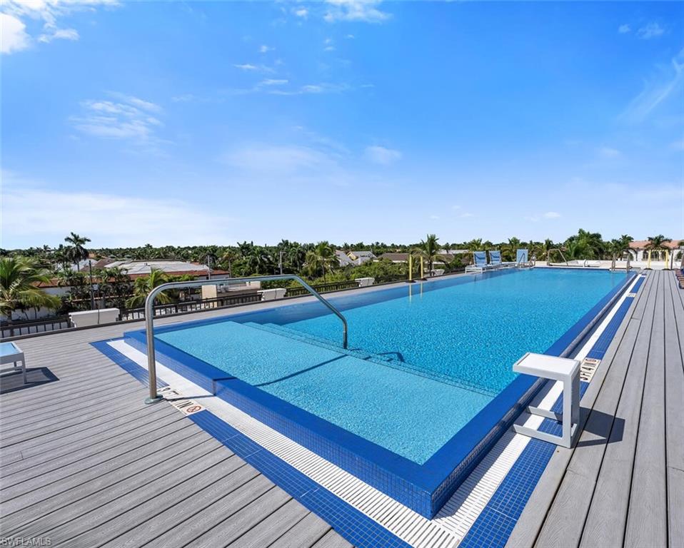 490 5th Street South, Unit 101 Naples, FL 34102 - Photo 48 of 50 a view of a chairs in a terrace