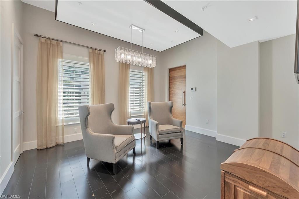 490 5th Street South, Unit 101 Naples, FL 34102 - Photo 7 of 50 a living room with furniture and a large window