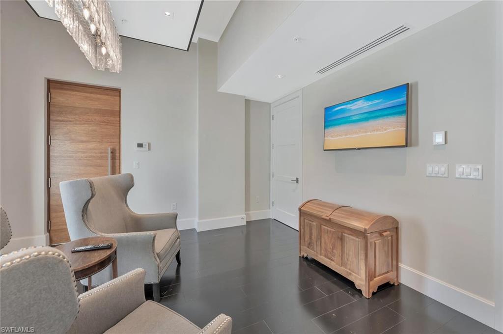 490 5th Street South, Unit 101 Naples, FL 34102 - Photo 8 of 50 a living room with furniture and a window