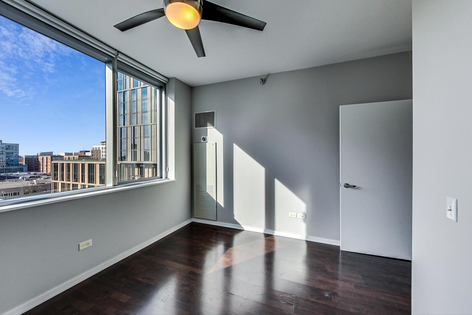 123 South Green Street, Unit 701B Chicago, IL 60607 - Photo 13 of 25 a view of a livingroom with wooden floor and staircase