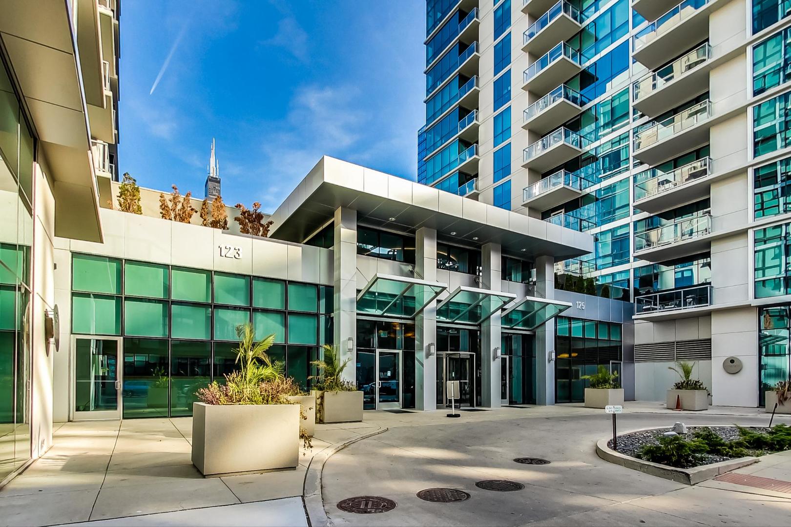 123 South Green Street, Unit 701B Chicago, IL 60607 - Photo 19 of 25 a front view of a building with a garden
