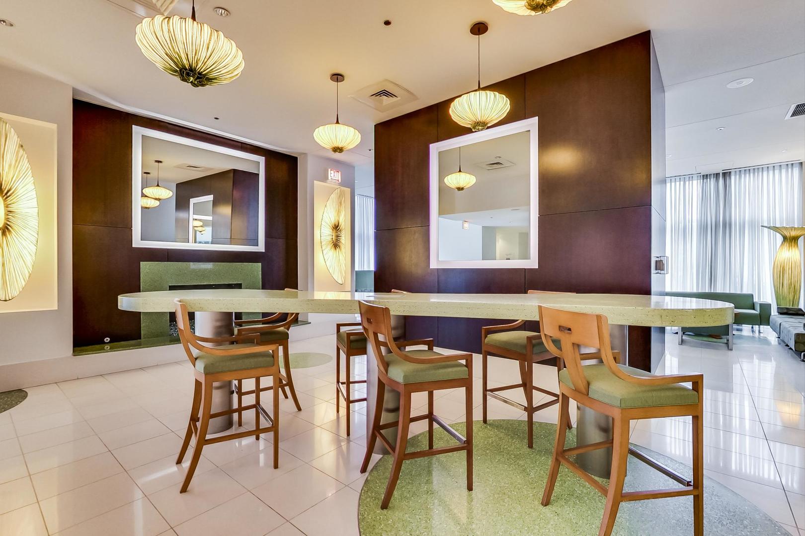 123 South Green Street, Unit 701B Chicago, IL 60607 - Photo 22 of 25 a view of a dining room with furniture and a chandelier