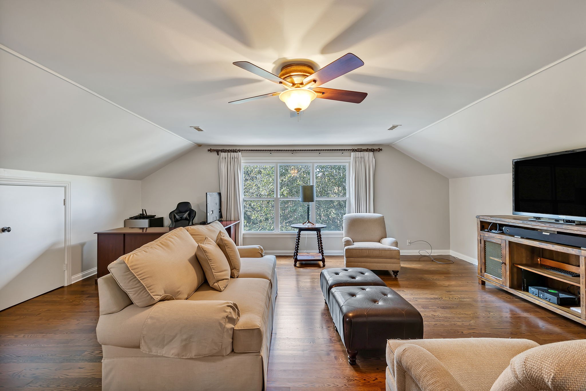 2829 Polo Club Road Nashville, TN 37221 - Photo 18 of 45 a living room with furniture a flat screen tv and a window