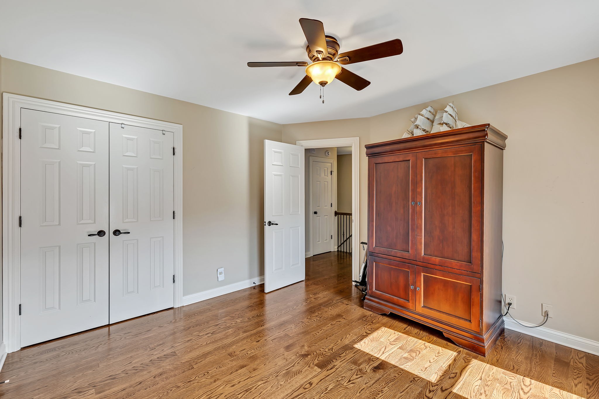 2829 Polo Club Road Nashville, TN 37221 - Photo 21 of 45 an empty room with wooden floor closet and windows