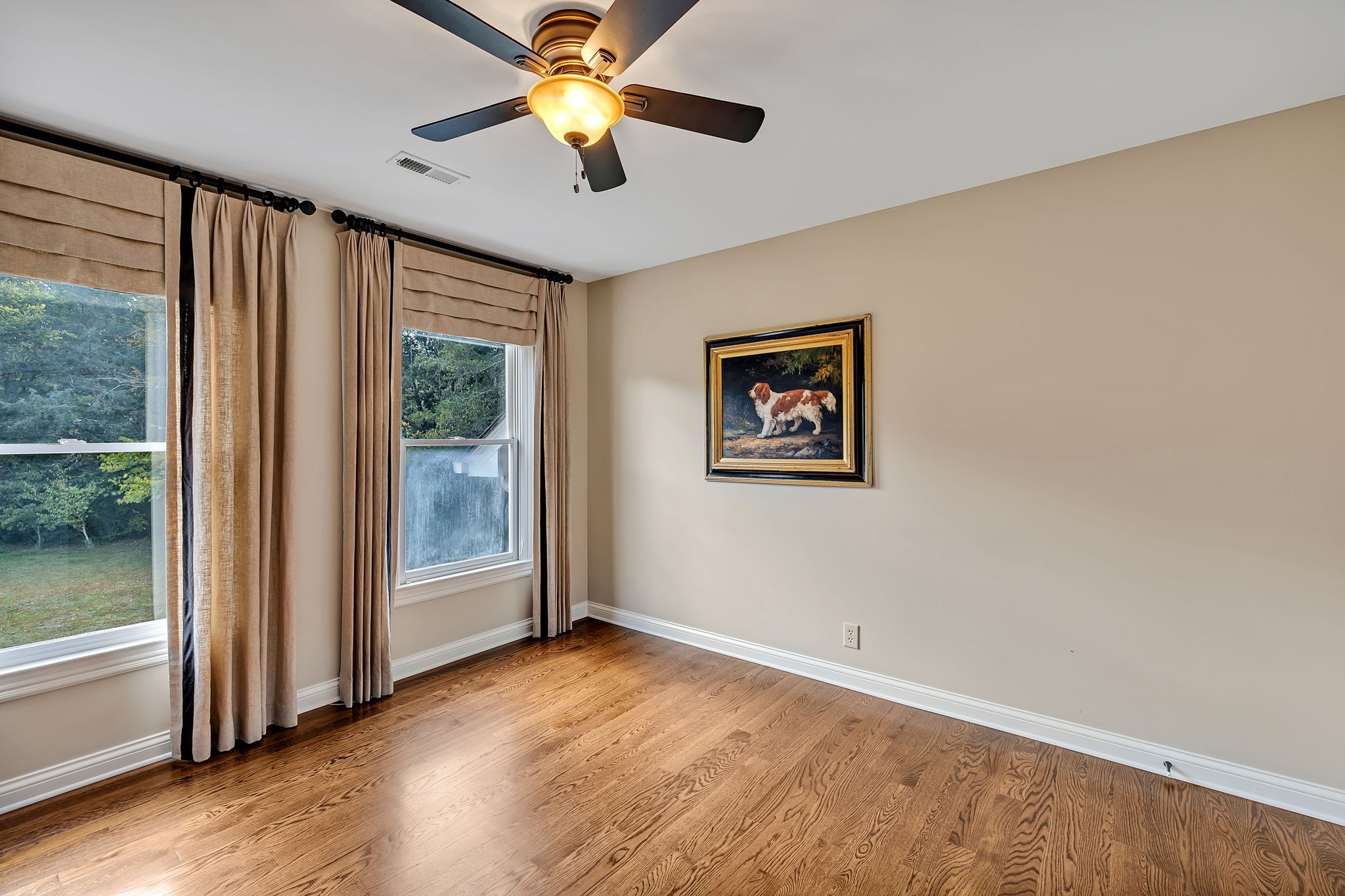 2829 Polo Club Road Nashville, TN 37221 - Photo 22 of 45 wooden floor in an empty room with a window