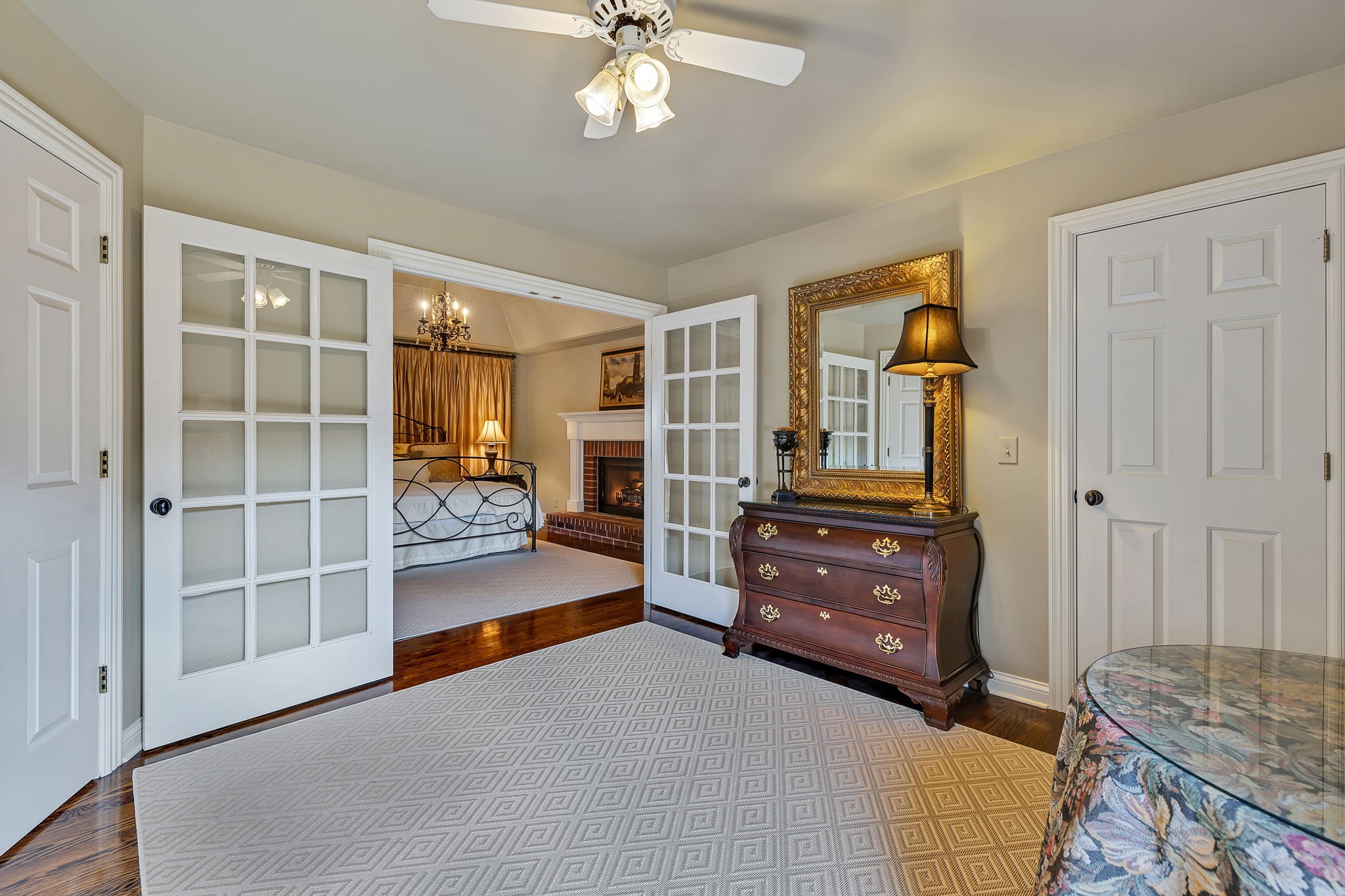 2829 Polo Club Road Nashville, TN 37221 - Photo 27 of 45 a living room with a dresser and a chandelier