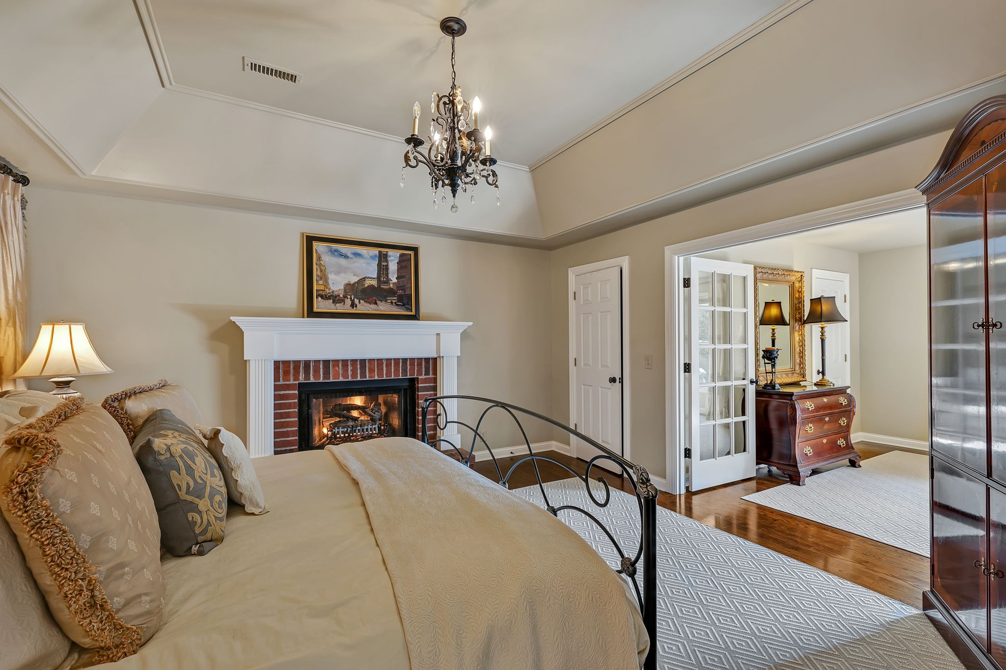 2829 Polo Club Road Nashville, TN 37221 - Photo 29 of 45 a view of a bedroom with furniture and chandelier