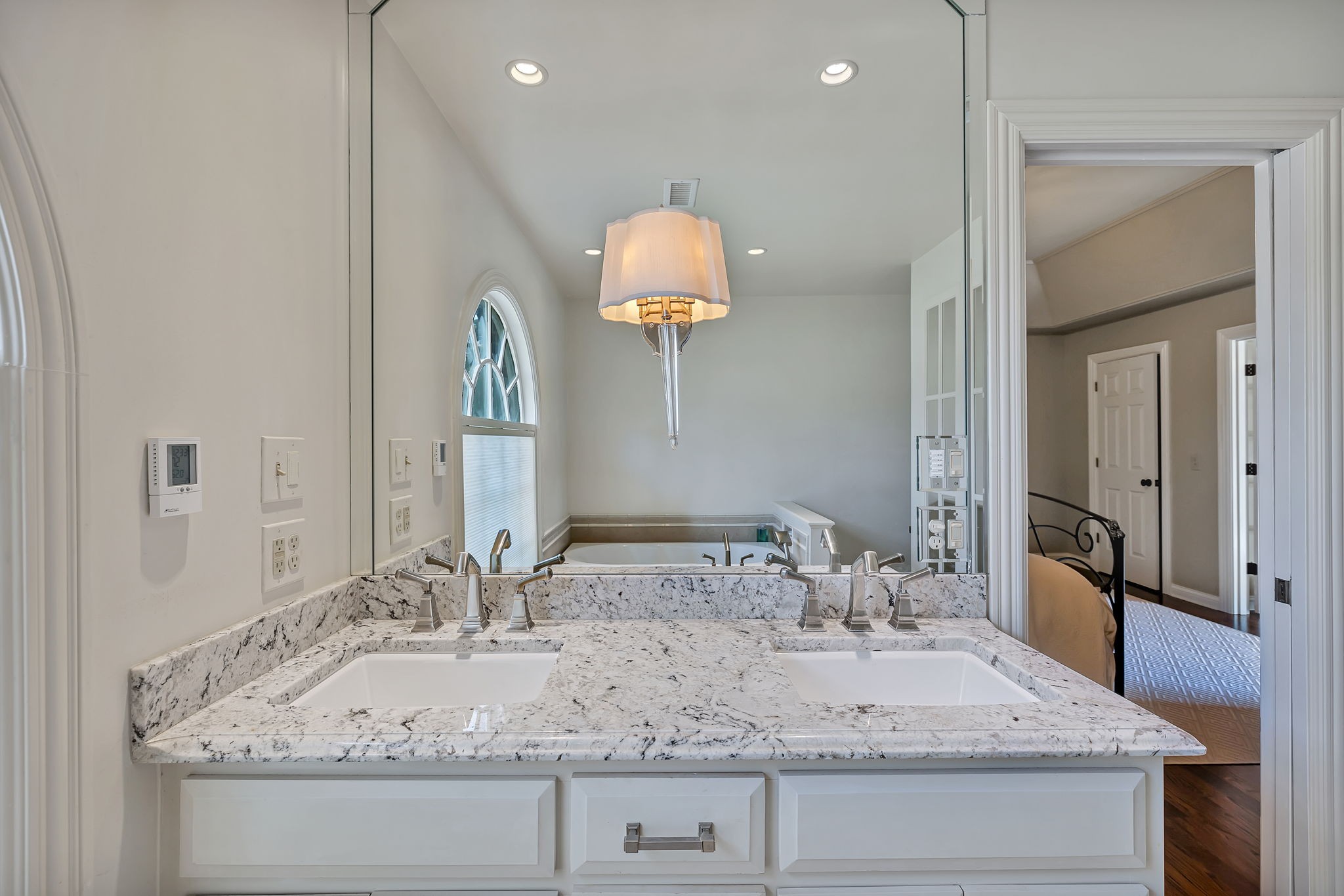 2829 Polo Club Road Nashville, TN 37221 - Photo 30 of 45 a bathroom with a granite countertop sink and a mirror
