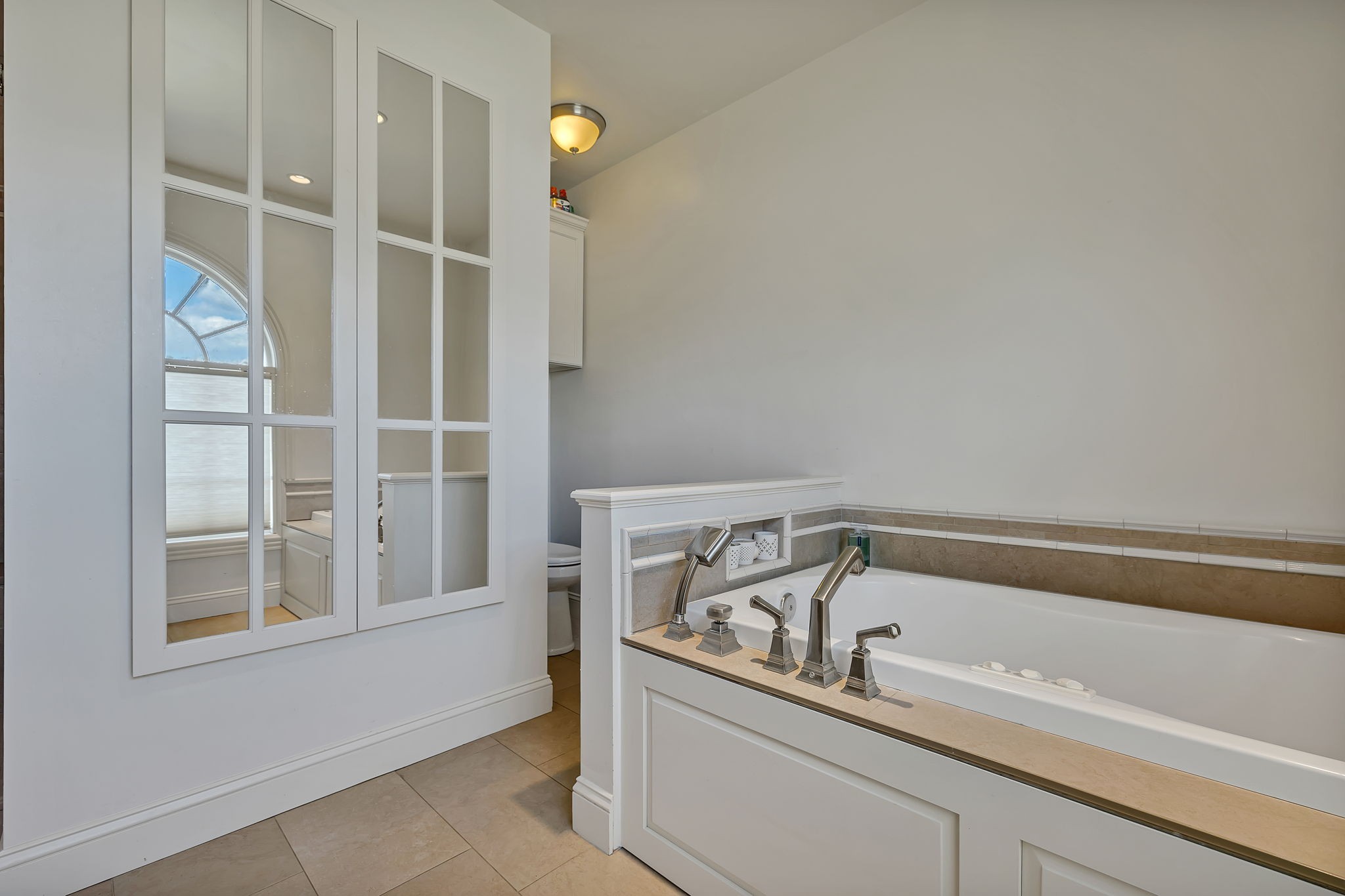 2829 Polo Club Road Nashville, TN 37221 - Photo 31 of 45 a bathroom with a bathtub and a window