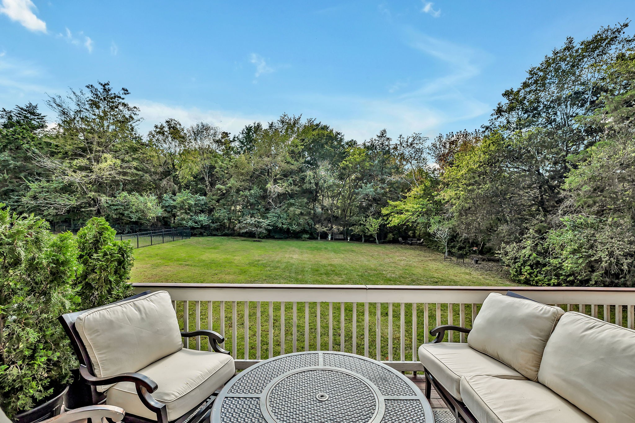 2829 Polo Club Road Nashville, TN 37221 - Photo 33 of 45 a view of a patio with couches chair and floor to ceiling window