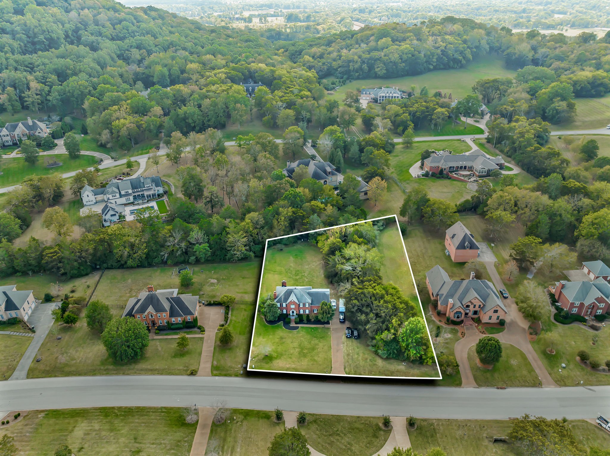 2829 Polo Club Road Nashville, TN 37221 - Photo 39 of 45 an aerial view of a house with a lake view