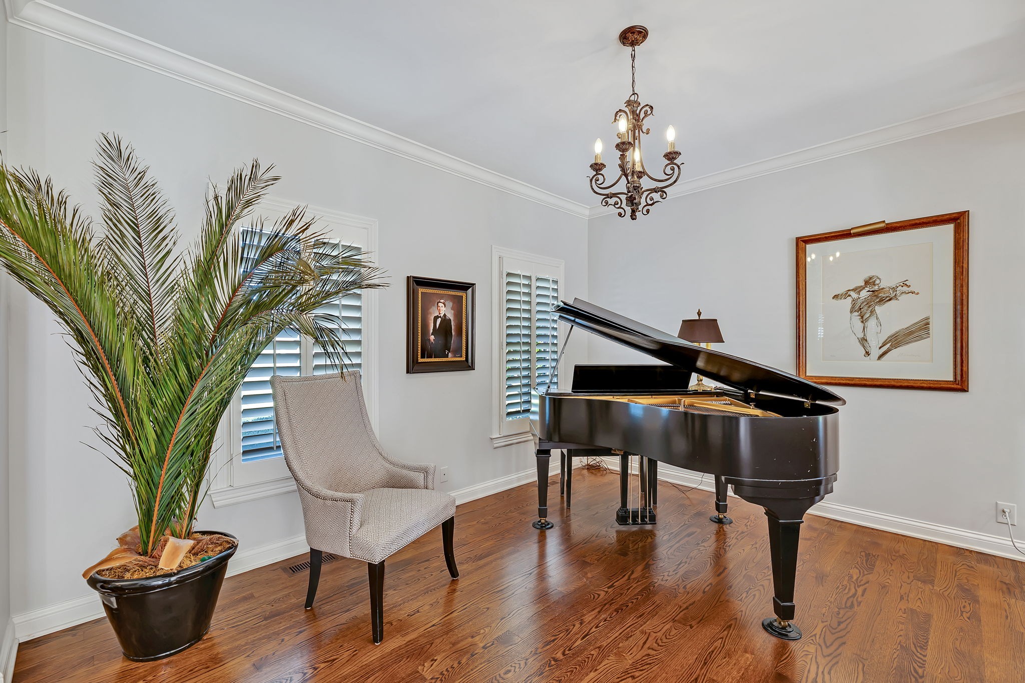 2829 Polo Club Road Nashville, TN 37221 - Photo 6 of 45 a living room with furniture flowers and a chandelier