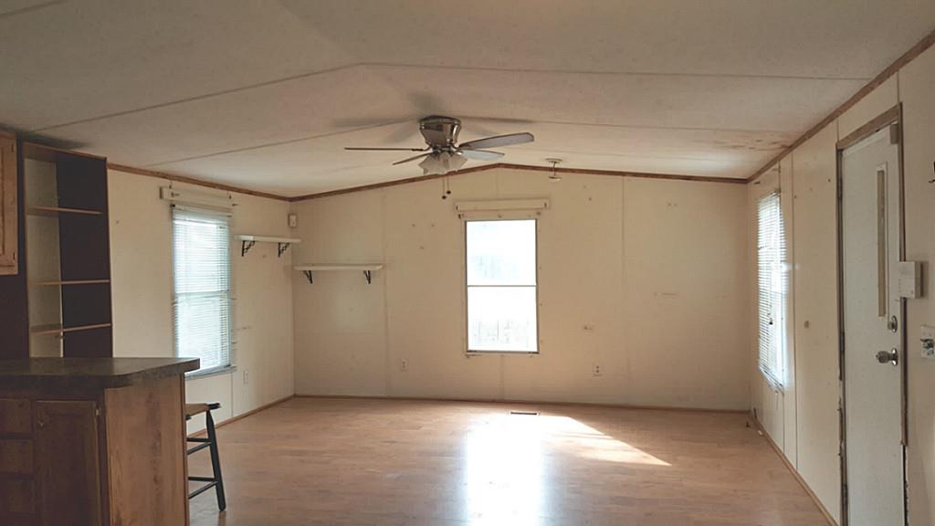 13289 Fm 2432 Road Willis, TX 77378 - Photo 4 of 7 an empty room with windows and closet