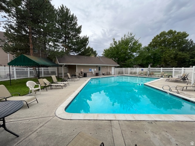 6884 670 East Midvale, UT 84047 - Photo 23 of 28 Community pool featuring a patio