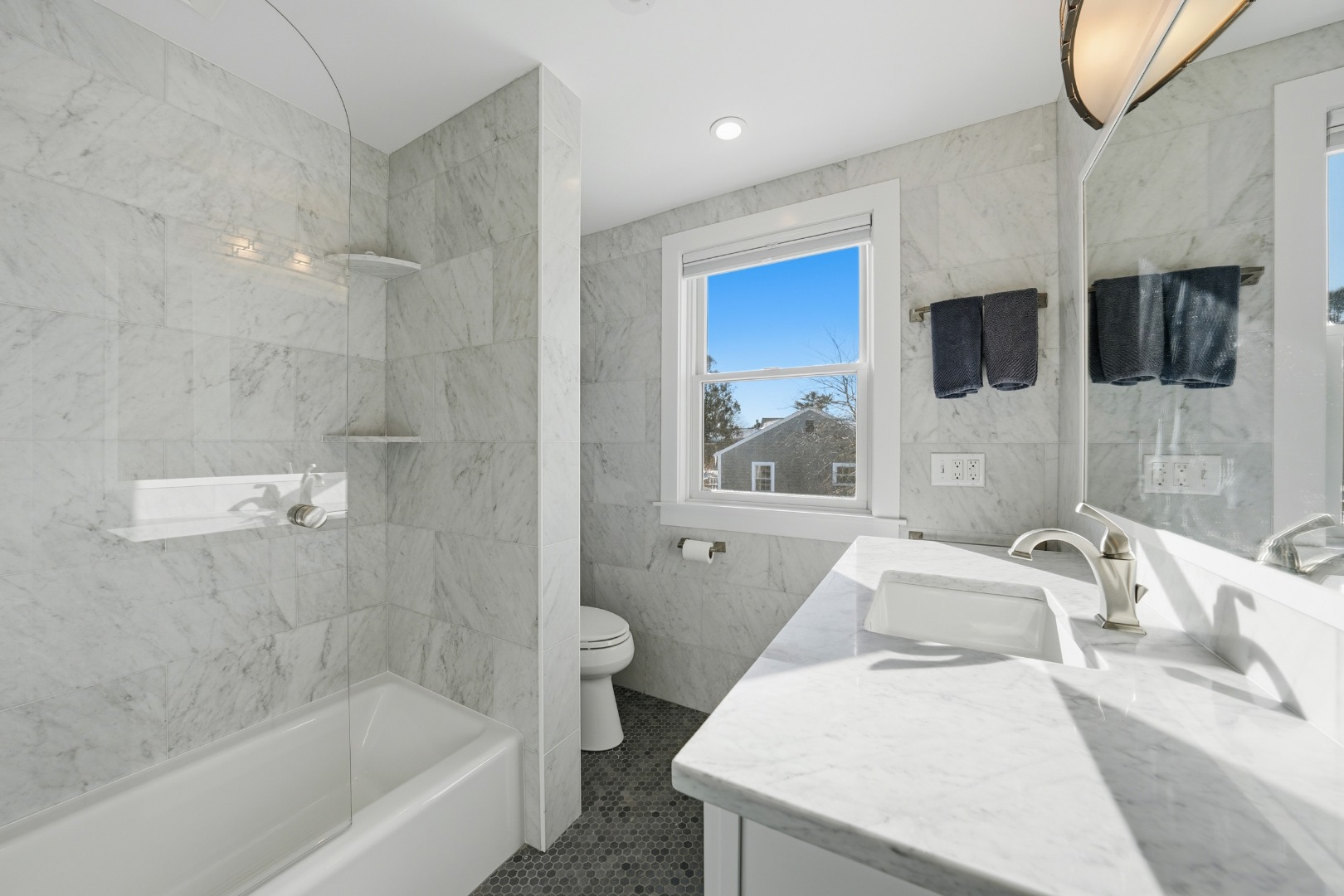 10 Pilgrim Road Nantucket, MA 02554 - Photo 43 of 65 a bathroom with a sink a bath tub and a shower