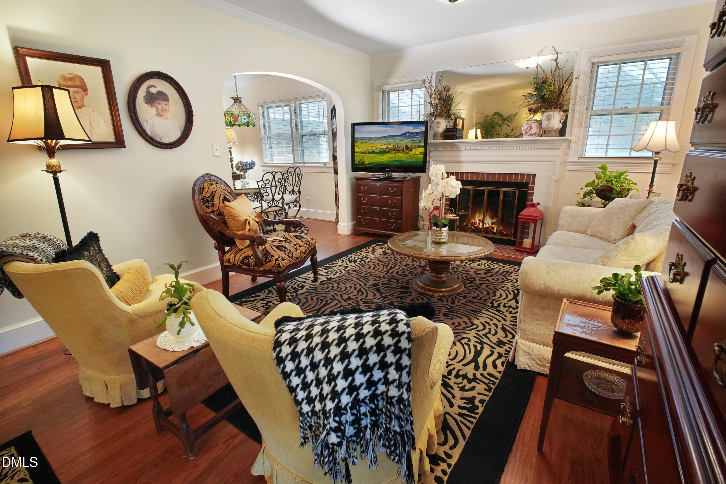 306 Warsaw Road Clinton, NC 28328 - Photo 27 of 42 a living room with furniture a fireplace with wooden floor