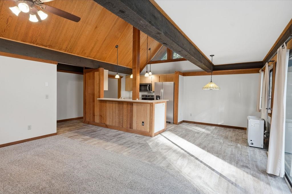 39 Graeagle Meadows Road, Unit 39 Graeagle, CA 96103 - Photo 11 of 48 a view of a kitchen with wooden floor and a kitchen