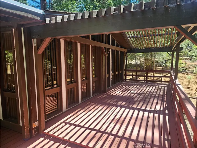 a view of outdoor space with wooden floor
