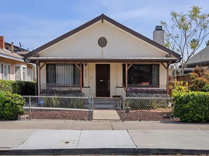 a front view of a house with garage
