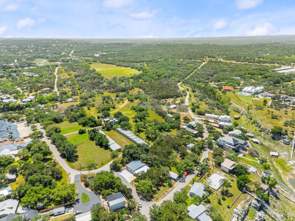 525 Pace Bend Road North Spicewood, TX 78669 - Photo 21 of 28 an aerial view of residential houses with outdoor space and swimming pool