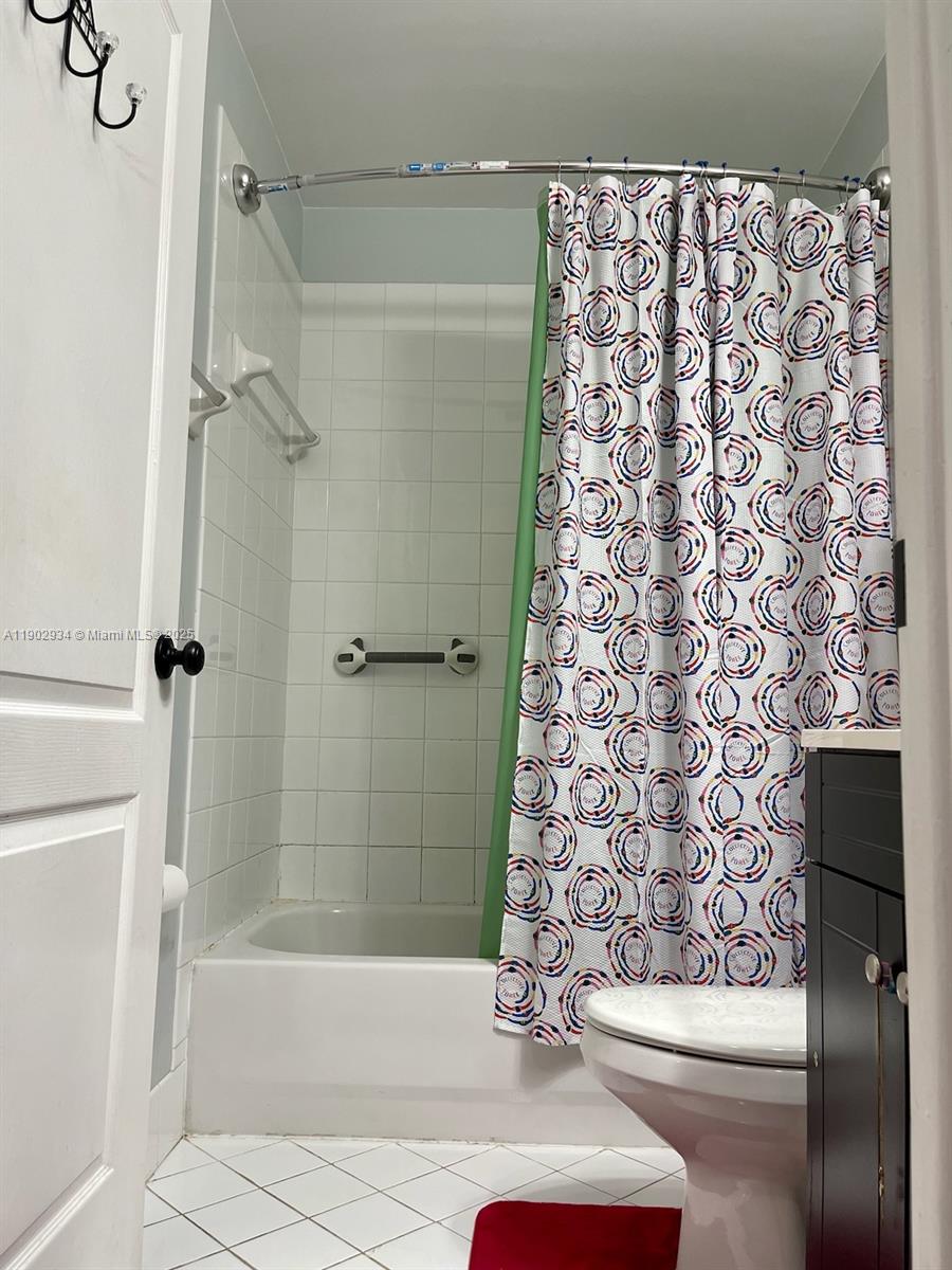 21316 Southwest 87th Place Cutler Bay, FL 33189 - Photo 5 of 14 a bathroom with a bathtub and shower