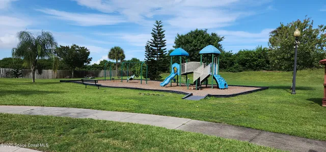 a view of playground with a slide