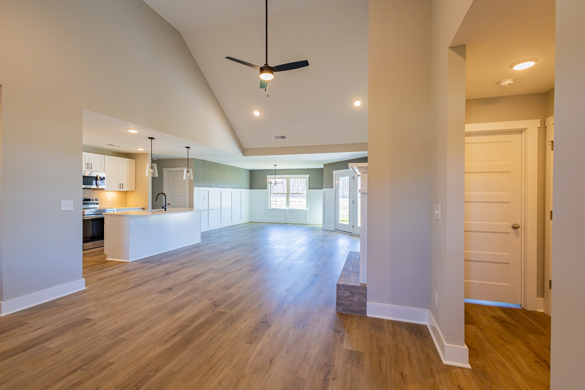 42 Brooklyn Avenue Manchester, TN 37355 - Photo 25 of 64 a view of a hallway with wooden floor and a kitchen